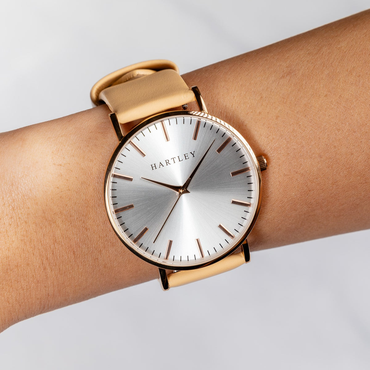 HERITAGE ROSE GOLD WHITE WITH BEIGE LEATHER ON WRIST